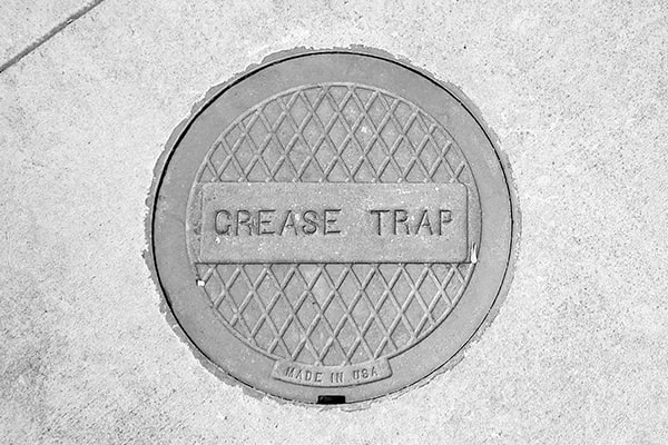 regular grease trap pumping helps to prevent foul odors, backups, and costly plumbing repairs